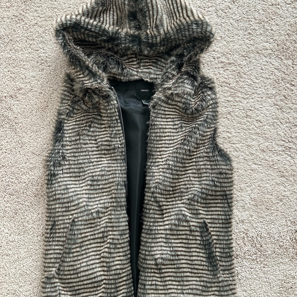 Forever 21 Black and Brown Fur hooded Vest with zipper and pockets.